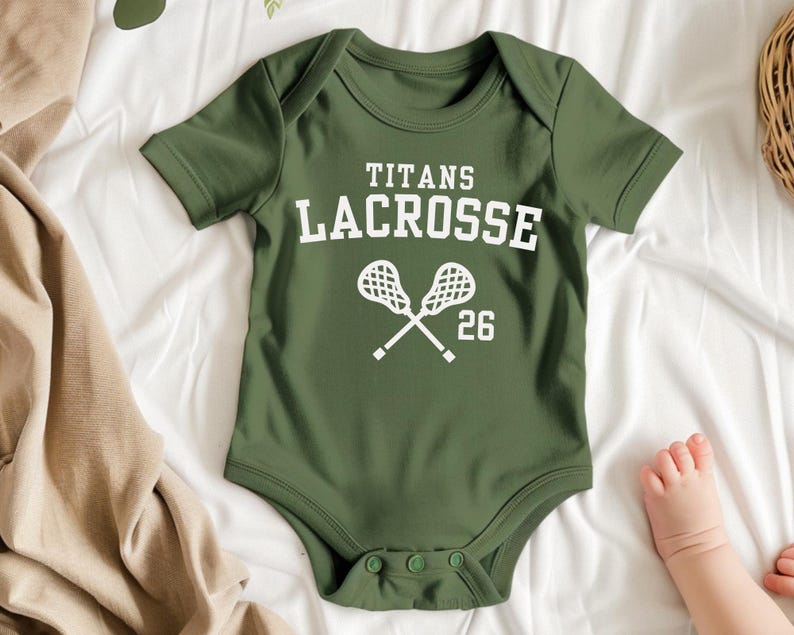 a baby bodysuit that says titans lacrosse on it