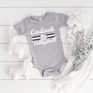 a baby bodysuit with the words cardinals volleyball on it