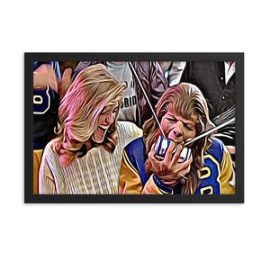 May include: A woman with long blonde hair is laughing while a man with long brown hair is holding a blue and yellow cup to his mouth. The man has a furry face and is wearing a blue and yellow jacket. The woman is wearing a white sweater.
