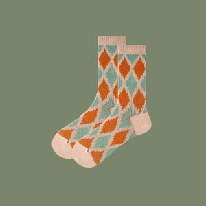 May include: A pair of socks with a diamond pattern in orange and light blue. The socks are made of a soft, comfortable material.
