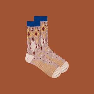 May include: A pair of socks with a geometric pattern in shades of brown, yellow, and red. The socks have a blue trim at the top.