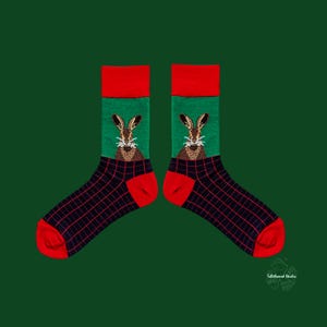 May include: A pair of novelty socks with a green, red, and black color scheme. The socks feature a red cuff and toe, a green midsection with a rabbit design, and a black and red plaid pattern.