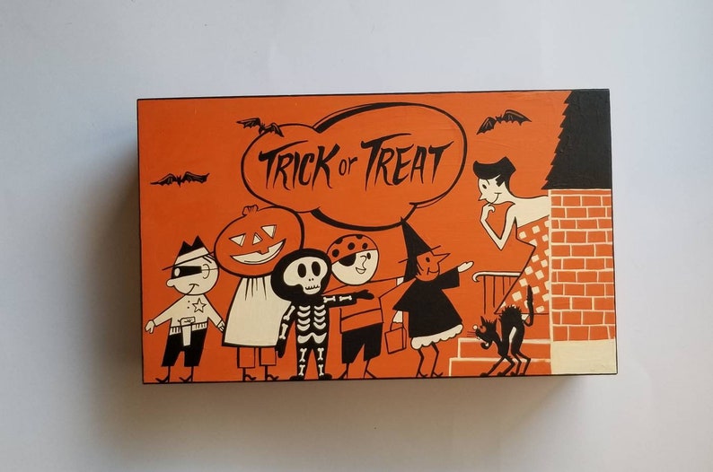 All hand painted vintage Halloween candy bag art on a wooden box