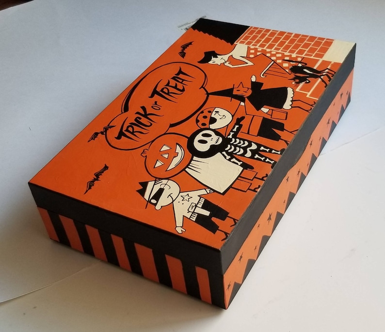 All hand painted vintage Halloween candy bag art on a wooden box