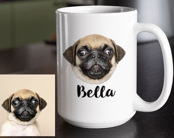 May include: White ceramic mug with a photo of a pug dog with the name "Bella" printed on the mug.