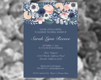 May include: A blue and white floral bridal shower invitation with the text "YOU ARE JOYFULLY INVITED TO CELEBRATE THE BRIDAL SHOWER OF Sarah Lynn Reeves SEPTEMBER 17, 2023 AT 4 O'CLOCK IN THE AFTERNOON Ponte Vineyard 80069 Rancho California Road Temecula, California 92591 Regrets only to Julia Salinger 555-984-0127 | jsallinger@gmail.com Sarah is registered at Macy's & Pottery Barn"