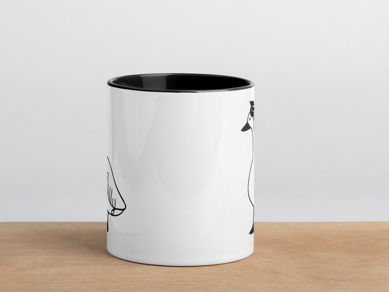 graduation era silly goose 2 tone mug black and white ceramic mug with graphic printed on both sides.