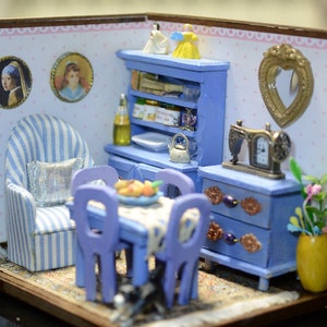 Lavender colored miniature living room, roombox with clock.