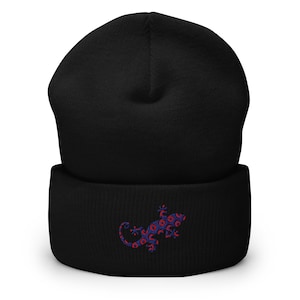 May include: Black beanie with a blue and red patterned gecko embroidered on the front.