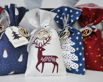 24 fabric bags to fill, Advent calendar bags, Advent calendar in traditional Christmas colors burgundy, blue and white.