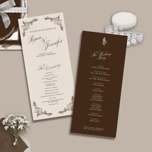 May include: Two rectangular wedding program cards, one cream with dark brown floral borders and text reading Welcome to the Wedding of Ryan & Jennifer, and one dark brown with white text listing The Wedding Party, accompanied by white lace ribbon.