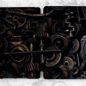 May include: A close-up of a dark background with a variety of gears and cogs in shades of gold, bronze, and black. The gears are arranged in a random pattern, creating a sense of movement and complexity.