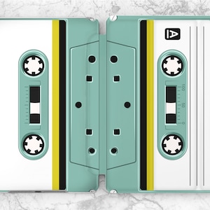 May include: A teal and white cassette tape design iPad case. The case has a yellow stripe and black details. The cassette tape has the letter "A" on the top right corner and a tape counter that reads from 0 to 100.