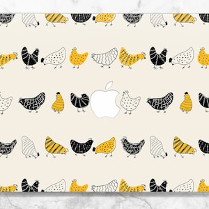 May include: A laptop skin with a repeating pattern of black, white, and yellow chickens. The skin is designed to fit a laptop with an Apple logo.
