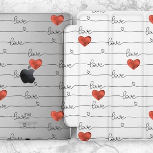 May include: A white iPad case with a black and red design. The case has a repeating pattern of the word "love" written in cursive with a red heart between each word.