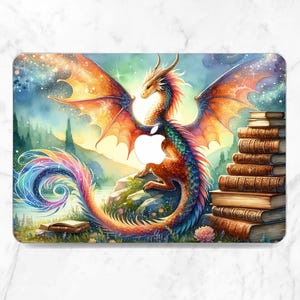 May include: A laptop cover featuring a vibrant dragon illustration. The dragon has orange wings, a green and red body, and a rainbow tail. A stack of books is on the right. The background shows a landscape with a lake and mountains.