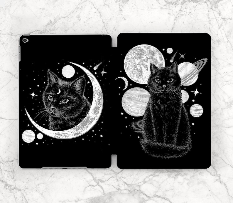 May include: Black and white illustration of a black cat sitting in a crescent moon with stars and planets in the background. The cat has a crescent moon on its forehead.