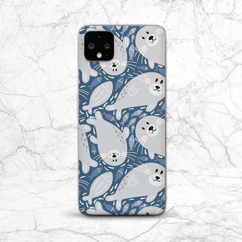 May include: A blue phone case with a pattern of gray seals and blue fish. The case has a cutout for the camera lens.