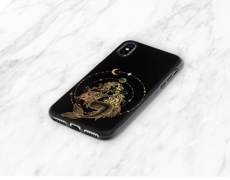 May include: Black phone case with a gold mermaid design and a crescent moon and stars.