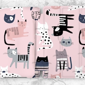 May include: Pink tablet case featuring a repeating pattern of stylized cats in various poses. The cats are in shades of black, gray, white, and pink, with striped and dotted details. The case is designed to protect the tablet.