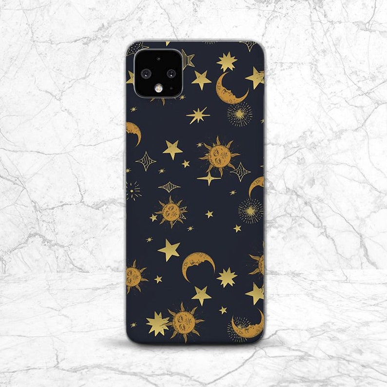 May include: A black phone case with a gold celestial pattern featuring moons, stars, and suns.