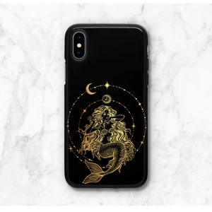 May include: Black phone case with a gold mermaid design and celestial accents. The mermaid is surrounded by a circle of stars and moons.