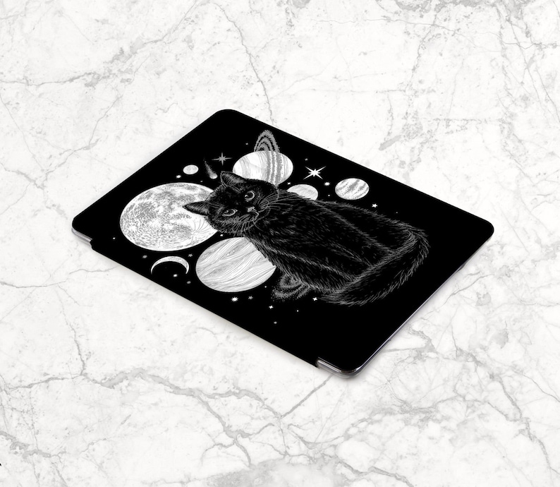 May include: Black and white illustration of a cat sitting on a black background with white planets and stars. The cat is looking directly at the viewer.