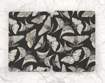 May include: A black iPad case with a repeating pattern of white and gold butterflies. The butterflies are stylized and have a vintage feel.
