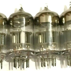 May include: A set of eight vintage glass vacuum tubes with metal bases and pins. The tubes are clear and have a silver-coloured finish.
