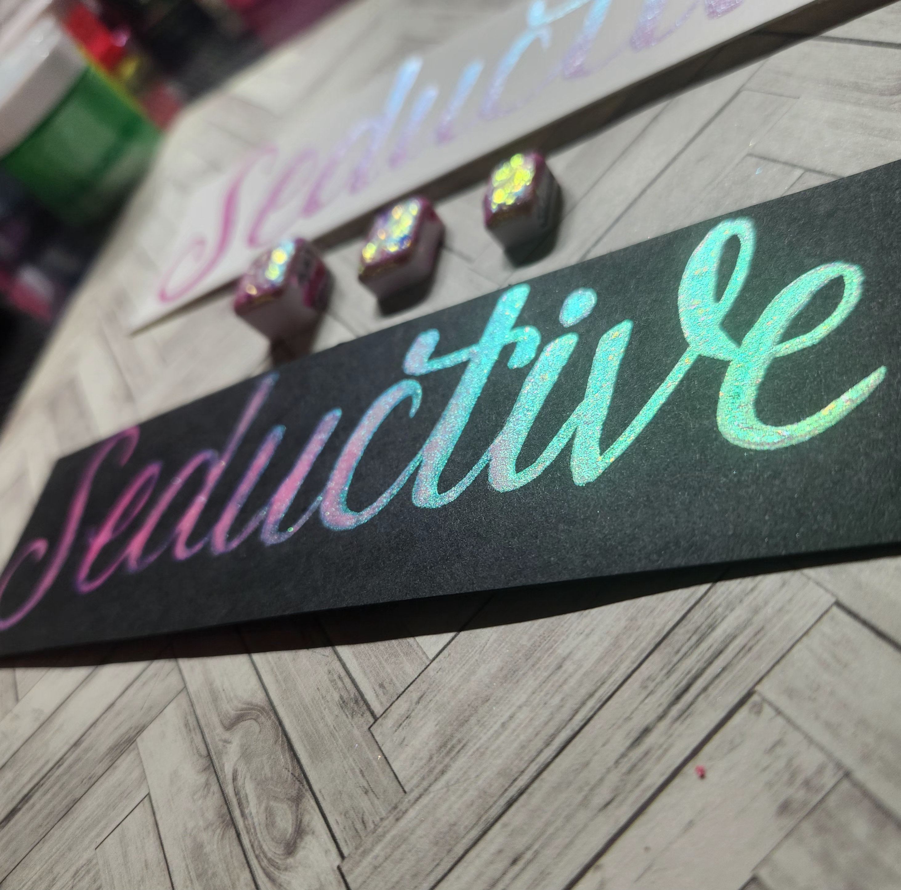 Colorshifting Handmade Watercolor Paint in Seductive! A Pink to blue, teal, green & yellow shift, with colorshift flakes added to each layer