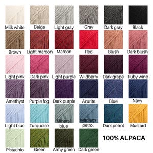 May include: A color chart displaying thirty-five square swatches of yarn in various shades including milk white, beige, gray, black, brown, maroon, red, blush, pink, purple, blue, green, and mustard, with the text 100% ALPACA in the bottom right corner.