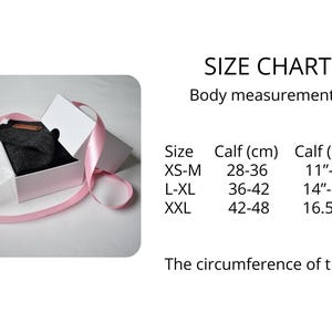 May include: A dark gray garment inside a white gift box wrapped with a pink ribbon, accompanied by a size chart listing calf measurements in centimeters and inches for sizes XS-M (28-36 cm, 11-14 inches), L-XL (36-42 cm, 14-16.5 inches), and XXL (42-48 cm, 16.5-19 inches).
