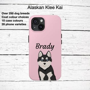 May include: Pink phone case featuring an Alaskan Klee Kai dog illustration with the name "Brady" in black script. The case has a black camera module and black side buttons. Text on the case reads "Over 250 dog breeds, 10 case colors, 28 phone varieties."