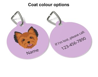 May include: Two light purple pet tags with silver metal clasps. One tag shows a cartoon dog with brown fur and black ears. The other tag has the text "If I'm lost, please call: 123-456-7890".
