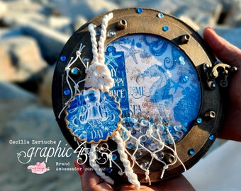 Tutoriel mini album Graphic 45 Ocean Blue. Hublot en forme de fenêtre album album PDF avec vidéos Scrapbooking Cecilia