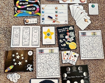 May include: A collection of educational materials for learning about space, including a game board, flashcards, coloring pages, and a moon phase mat. The materials feature planets, stars, rockets, and astronauts.
