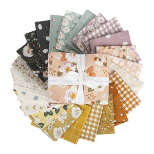 May include: A set of 18 fabric squares featuring floral and geometric patterns in shades of pink, green, yellow, brown, and white. The fabric squares are arranged in a circle and tied together with a white ribbon. Riley Blake Designs.