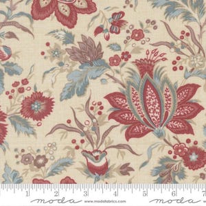 May include: Close-up of fabric with a floral pattern. The design features large, stylized flowers in shades of red, blue, and mauve against a cream-colored background. The fabric has a vintage or antique aesthetic, with a ruler along the bottom.