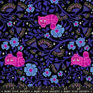 May include: A black fabric with a repeating pattern of pink Cheshire cats, blue and pink flowers, and purple vines. The design includes small white star accents. The words "RUBY STAR SOCIETY" are printed at the bottom.