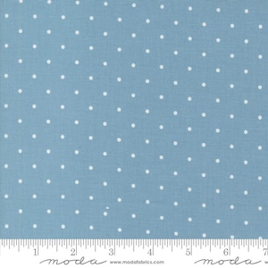 May include: A blue fabric with a white polka dot pattern. The fabric is textured and has a subtle sheen.