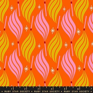 May include: Orange fabric with a repeating pattern of stylized matches and starbursts. The matches have pink and yellow flames, with red match heads. The fabric is from Ruby Star Society.
