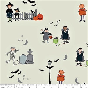 May include: Halloween-themed fabric with a repeating pattern of cartoon characters. The design includes trick-or-treaters, pumpkins, bats, a graveyard, and a street lamp. The color palette is soft, with a cream background and black, orange, and gray accents.