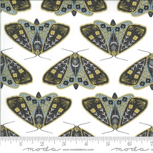 May include: White fabric with a repeating pattern of black, gold, and blue moths. The moths have intricate details and are arranged in a staggered pattern.