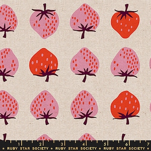 May include: A seamless fabric pattern featuring a repeating design of pink and orange strawberries with white seeds on a beige background. The fabric is from Ruby Star Society.
