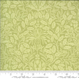 May include: A light green fabric with a repeating pattern of stylized leaves, acorns, and floral elements. The design is in a lighter shade of green, creating a subtle contrast. The fabric has a vintage or botanical theme.