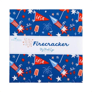 May include: A square stack of fabric squares featuring a blue background with a repeating pattern of red and white rockets, USA pennants, popsicles, cherries, and stars. A white paper band across the center displays the text Firecracker.