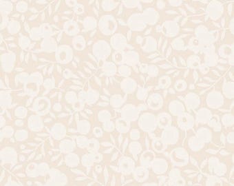 May include: A light beige fabric featuring a repeating pattern of white silhouettes of berries and leaves. The design consists of soft, rounded shapes representing fruit clusters and foliage, creating a monochromatic and subtle botanical print.