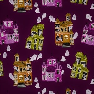 May include: A purple background with a repeating pattern of colorful houses and ghosts. The houses are in shades of purple, green, and orange. The ghosts are white and have a simple, cartoon-like design.