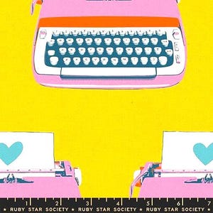 May include: Pink and orange vintage typewriter with a white keyboard and black keys, set against a bright yellow background. The image includes the text "RUBY STAR SOCIETY" at the bottom.