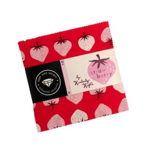 May include: A stack of 5-inch fabric squares with a red strawberry pattern. The label reads "Strawberry" and "by Kimberly Knight." The Ruby Star Society logo is also visible. Contains 42 pieces.